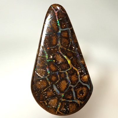 SOLID BOULDER OPAL Perfect flagstones surrounded by gem opal rivers, bright sparkles. Red, orange, green, blue.